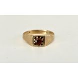 A lady's modern 9ct gold and garnet dress ring, of geometric design, the face claw set with a