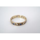 A vintage 9ct gold and spinel eternity ring, the round-cut stones sunken set in an alternating