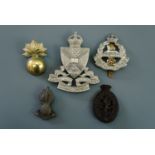 Sundry British army cap badges including Royal Marine Artillery, Edinburgh University OTC, War