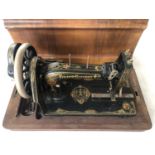 A vintage Frister& Rossman hand-cranked sewing machine