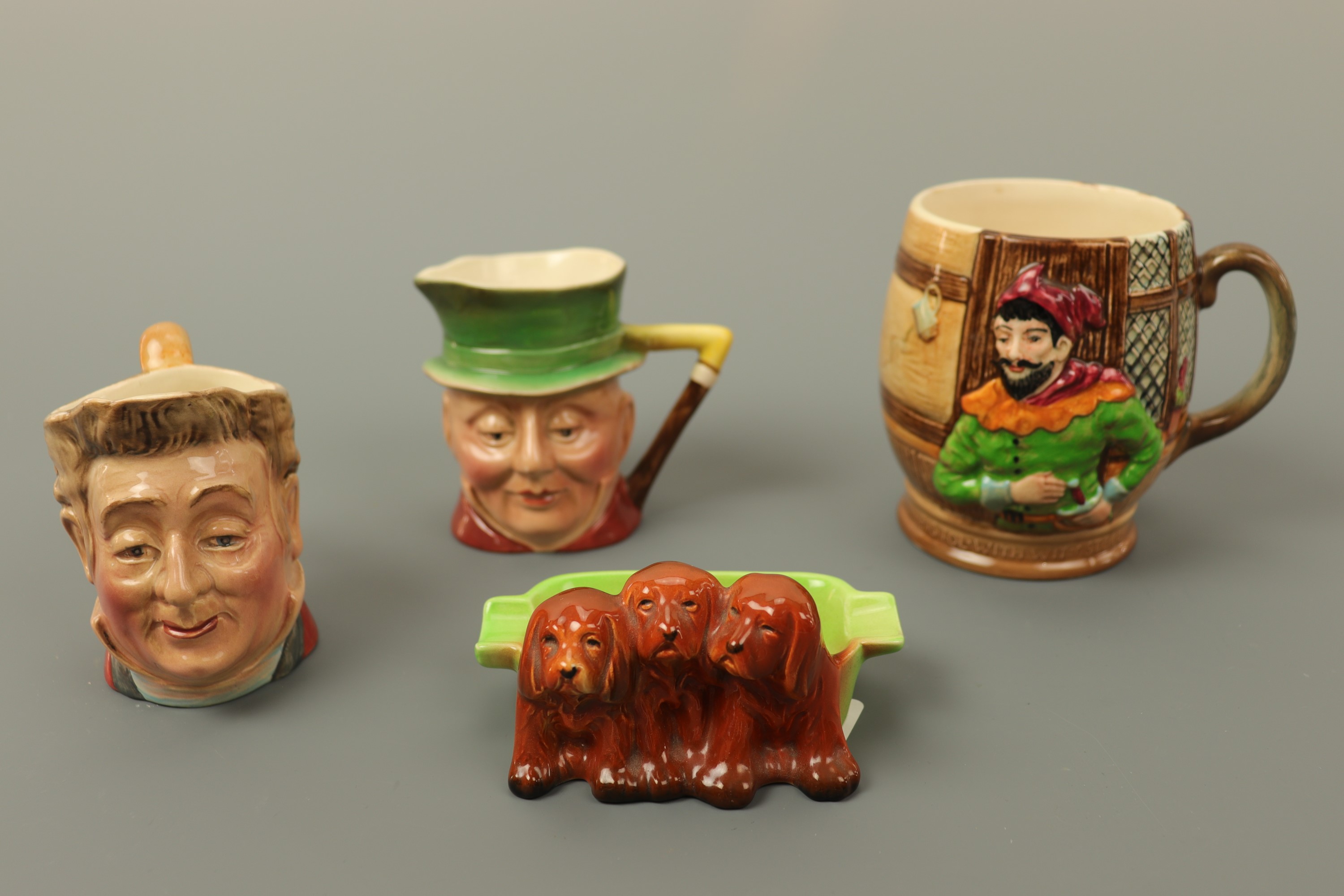 Two Beswick character jugs, a Beswick cup, etc.