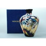 A contemporary Moorcroft shouldered vase, the decoration depicting butterflies in tropical