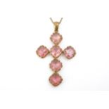 A Victorian large pendant cross of pink paste stones set on gilt metal, 7.5 cm, suspended on a