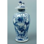 A Quing Chinese blue and white covered vase, of inverted baluster form, with dog of Fo finial,