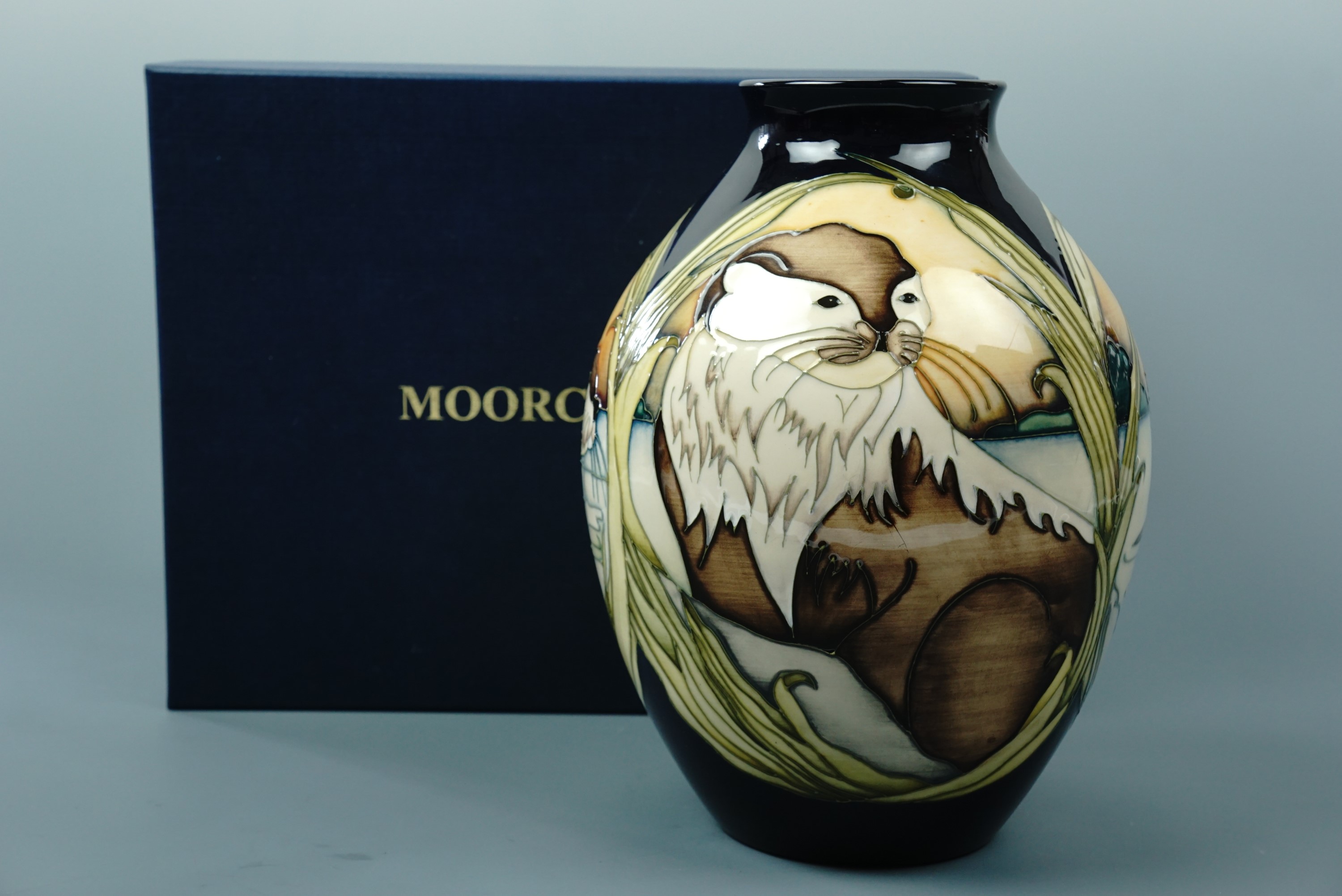 A contemporary Moorcroft limited edition shouldered vase, the decoration depicting otters, signed