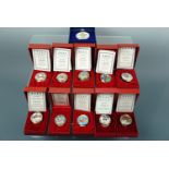 Eleven Halcyon Days enamel Christmas boxes, 1990 - 2000, boxed with documents