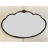 An Art Deco cloud shaped mahogany wall mirror, circa 1920s - 1930s