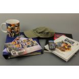 A Doctor Who mobile phone, trading cards, book etc.