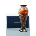 A contemporary Moorcroft inverted baluster vase of slender form, the decoration depicting poppies,