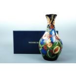 A contemporary Moorcroft limited edition baluster vase, the decoration depicting a butterfly amid