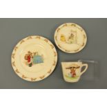 A Royal Doulton Bunnykins tea cup, saucer and side plate, (minor wear)