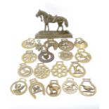 A quantity of horse brasses together with a hearth ornament