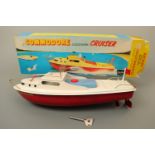 A Sutcliffe Model "Commodore" clockwork cruiser tinplate toy boat, in original carton