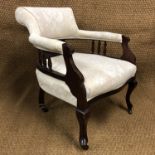 A pair of late Victorian horse-shoe-back tub armchairs, (one chair leg a/f)