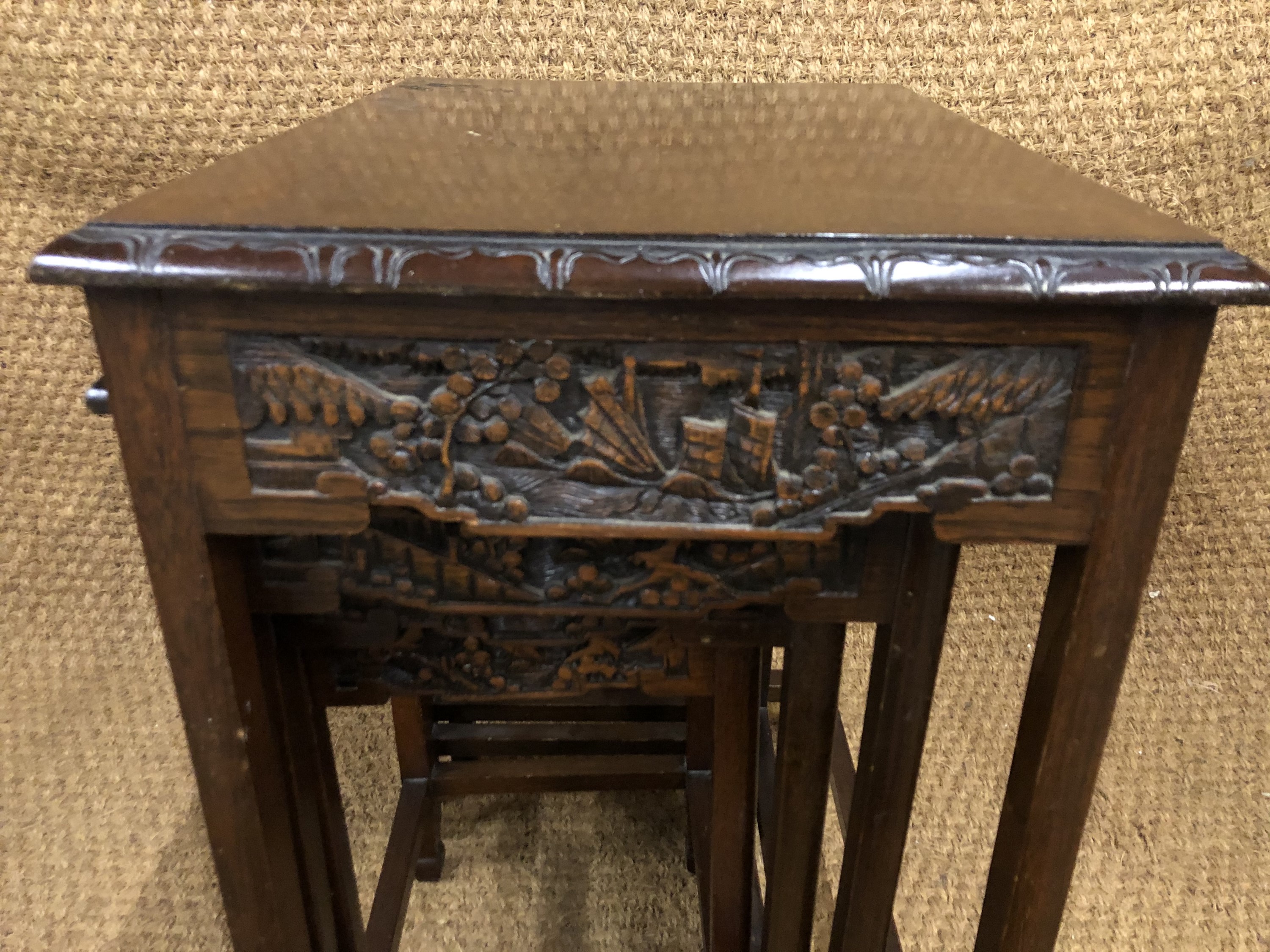 An early 20th Century Chinese carved hardwood nest of tables, 53 cm x 39 cm x 67 cm high - Image 2 of 4