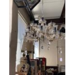 A 20th Century glass chandelier 30 cm drop, 53 cm width