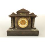 A Victorian black slate and green variegated marble mantle clock of classical architectural form, 37