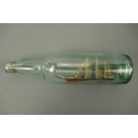 A vintage ship in a bottle, the vessel bearing the name 'Marga', 31 cm