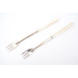 A pair of early 20th Century mother-of-pearl handled silver pickle forks, 13 cm