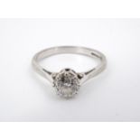 A .50 ct diamond solitaire ring on an 18ct white gold shank, the brilliant-cut diamond being crown