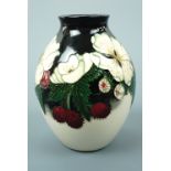 A contemporary Moorcroft limited edition ovoid form vase, the decoration depicting anemones,