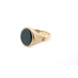 A yellow metal (tested as gold) and bloodstone signet ring, partial '9ct' mark, size, size X, 4.7g