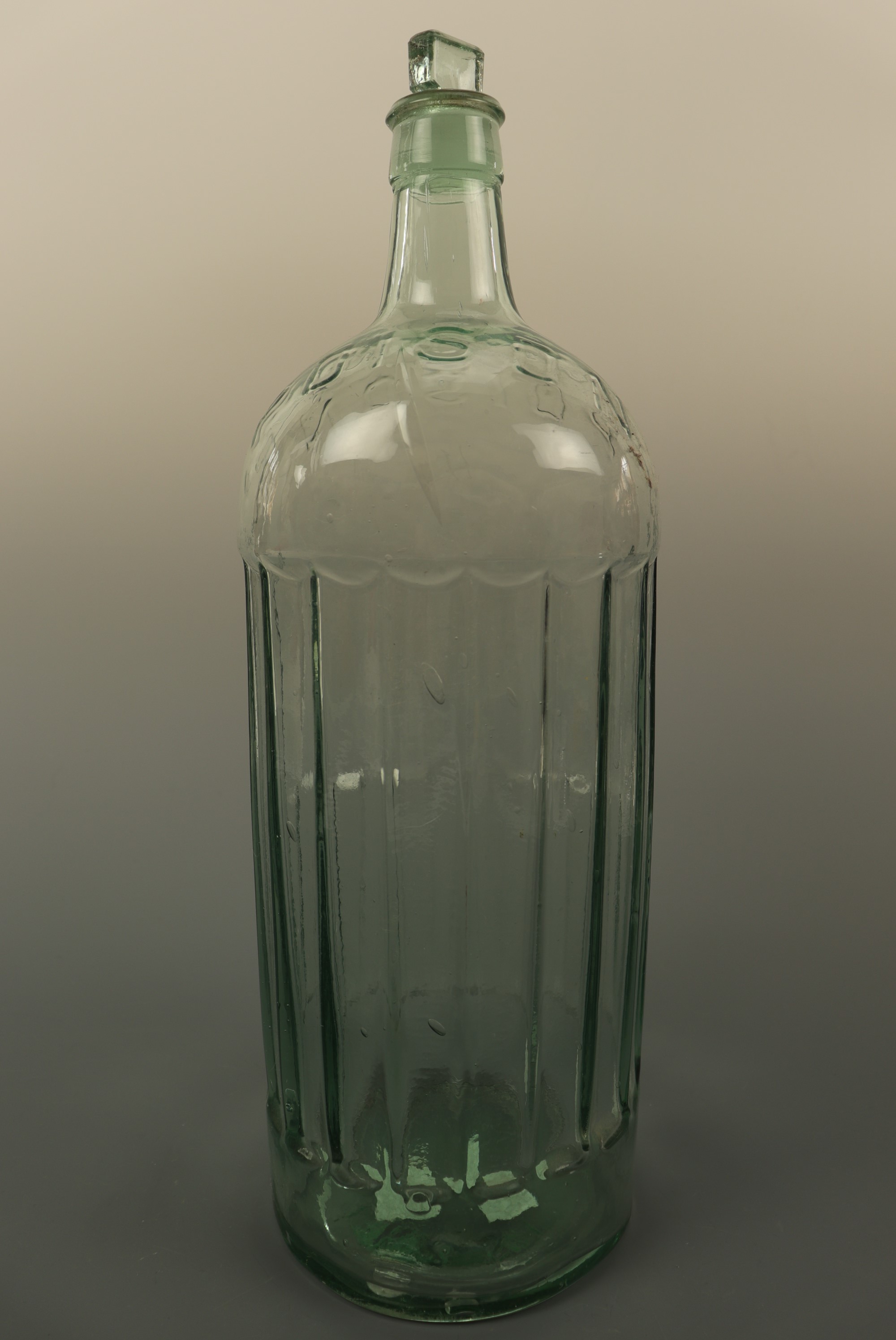 A vintage glass poison bottle, 38 cm high