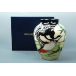 A contemporary Moorcroft limited edition RSPB shouldered vase, the decoration depicting woodpeckers,