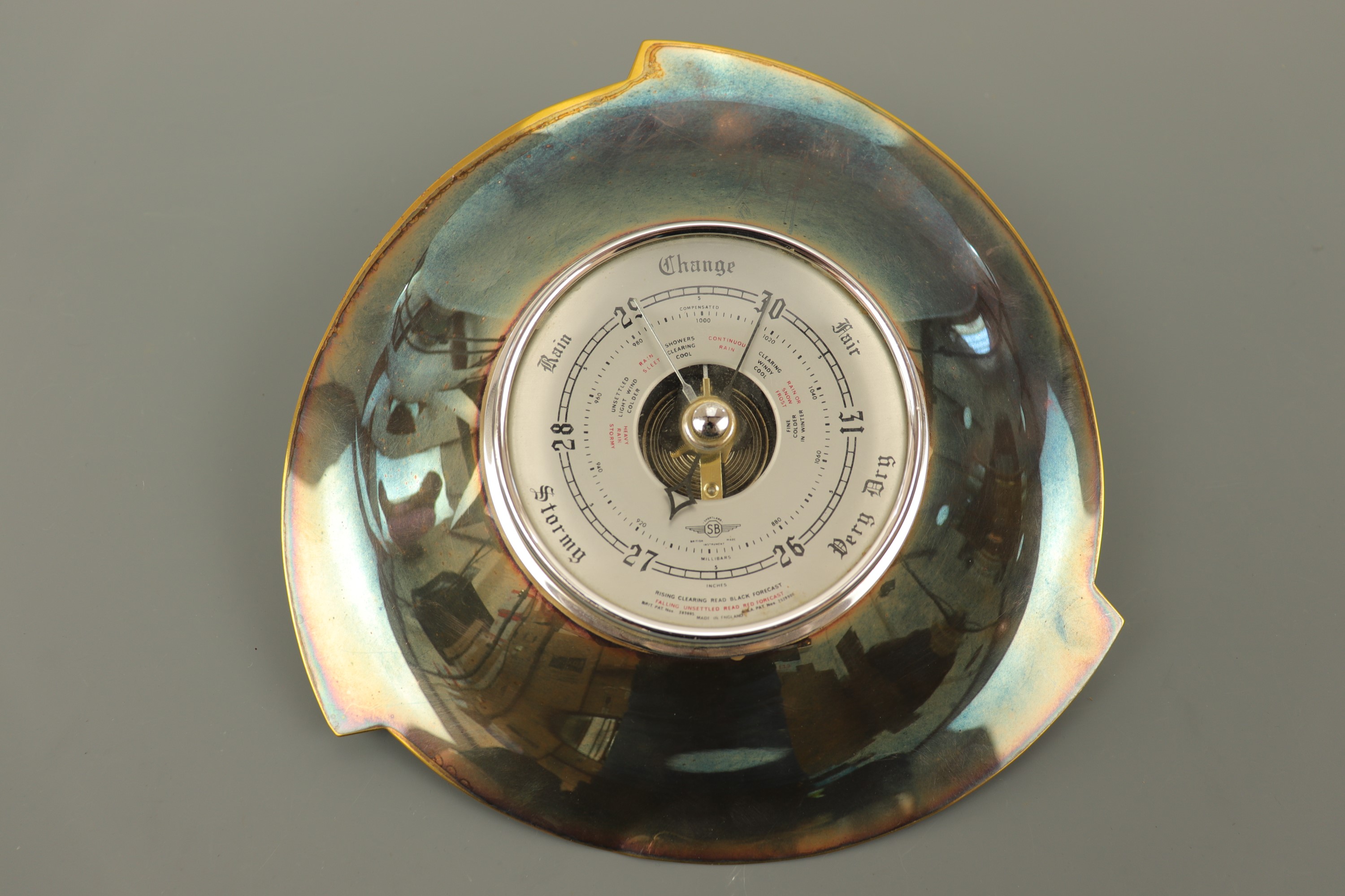 A 1960s Shortland moderne anodised barometer, 23 cm diameter