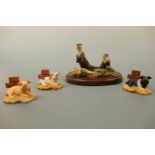 A Border Fine Art otter, RW2, 9 cm high, boxed, together with three piglets