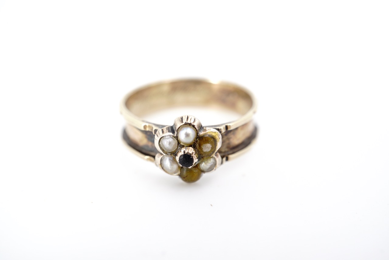 A Victorian yellow metal and seed pearl mourning ring, engraved "In memory of Fanny Openshaw, Obit
