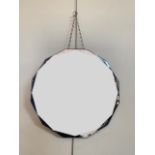 A bevel edged polygonal wall mirror circa 1930s - 1950s, 46 cm diameter