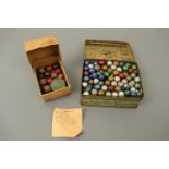 Vintage glass and ceramic marbles / game pieces, a quantity contained within a Player's Navy Cut