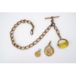 A Victorian rolled-gold watch chain with pendant fob seal, T-bar and swivel, 28 cm, together with