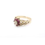 A lady's vintage 9ct gold garnet and diamond dress ring, in a flowerhead cluster arrangement, with