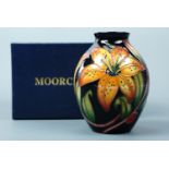 A contemporary Moorcroft limited edition ovoid form vase, the decoration depicting tiger lily