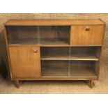 A glazed teak side cabinet, circa 1960s, 122 cm x 28 cm x 95 cm