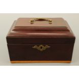 A George III mahogany tea caddy, with satinwood inlay, opening to reveal two covered compartments,