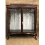 A George V astragal-glazed mahogany display cabinet on short cabriole legs with carved claw-and-ball
