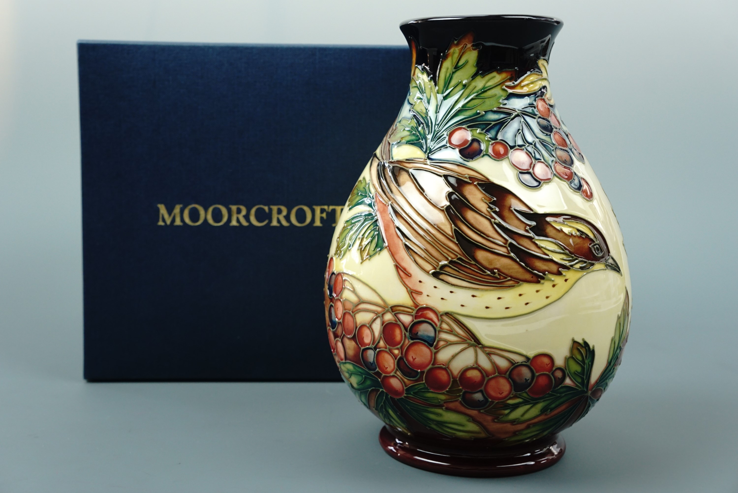 A contemporary Moorcroft limited edition inverted baluster vase, the decoration depicting a bird