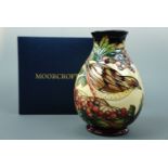 A contemporary Moorcroft limited edition inverted baluster vase, the decoration depicting a bird