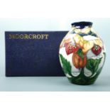 A contemporary Moorcroft ovoid form vase, the decoration depicting snow covered flowers, signed