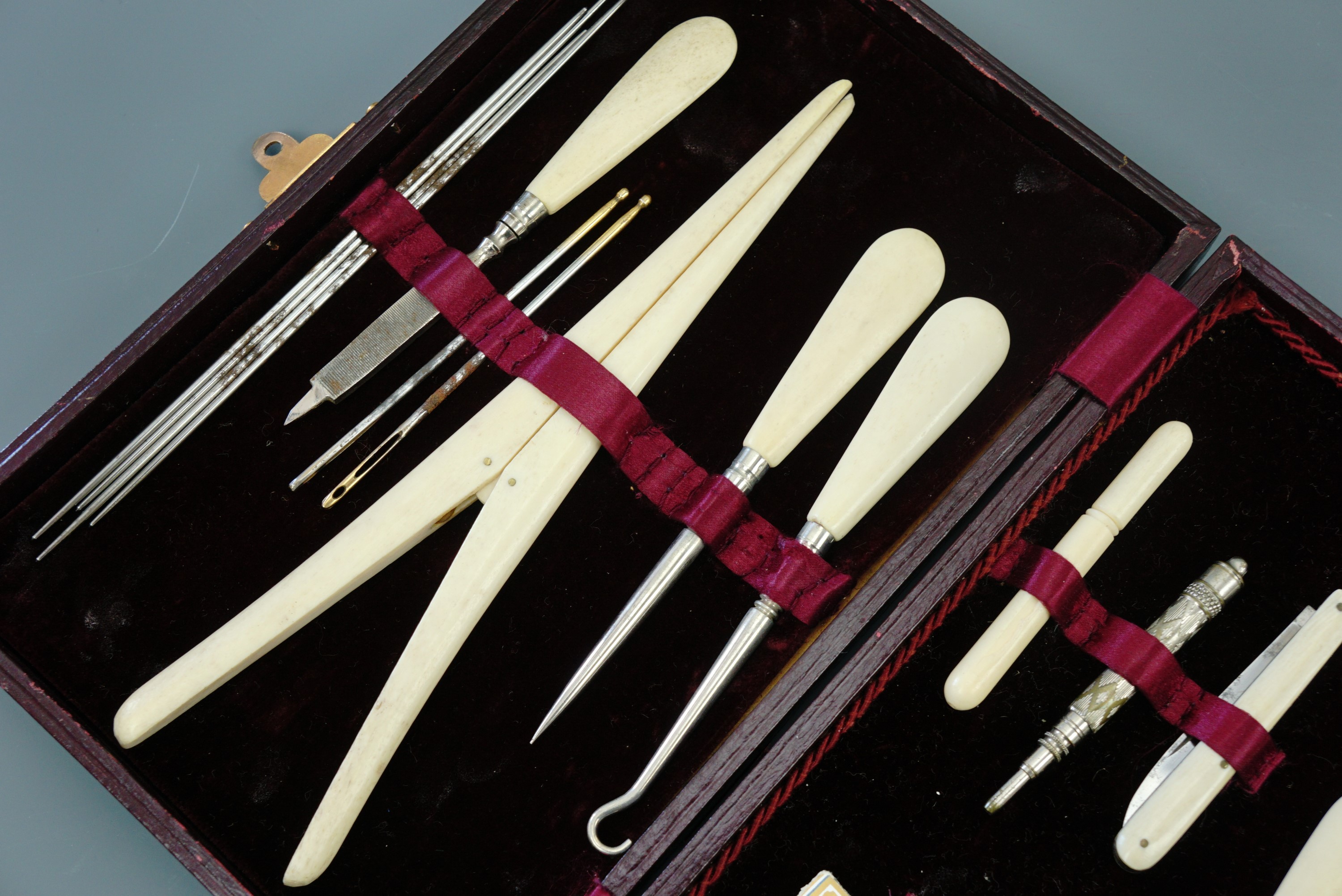 A Victorian lady's bone and polished steel sewing, dressing and manicure set in gilt-tooled claret - Image 3 of 3