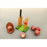 Cricket bat and stumps bookends together with cricket ball clock etc.
