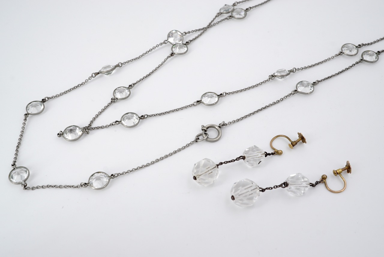 A vintage sautoir necklace, the fine belcher link chain interspersed with bezel-set paste stones,