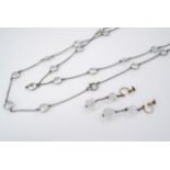 A vintage sautoir necklace, the fine belcher link chain interspersed with bezel-set paste stones,