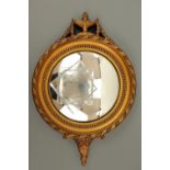 A small gilt circular mirror, 37 cm high