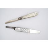 A late Victorian silver and mother of pearl folding fruit knife, with spirally fluted grip scales,