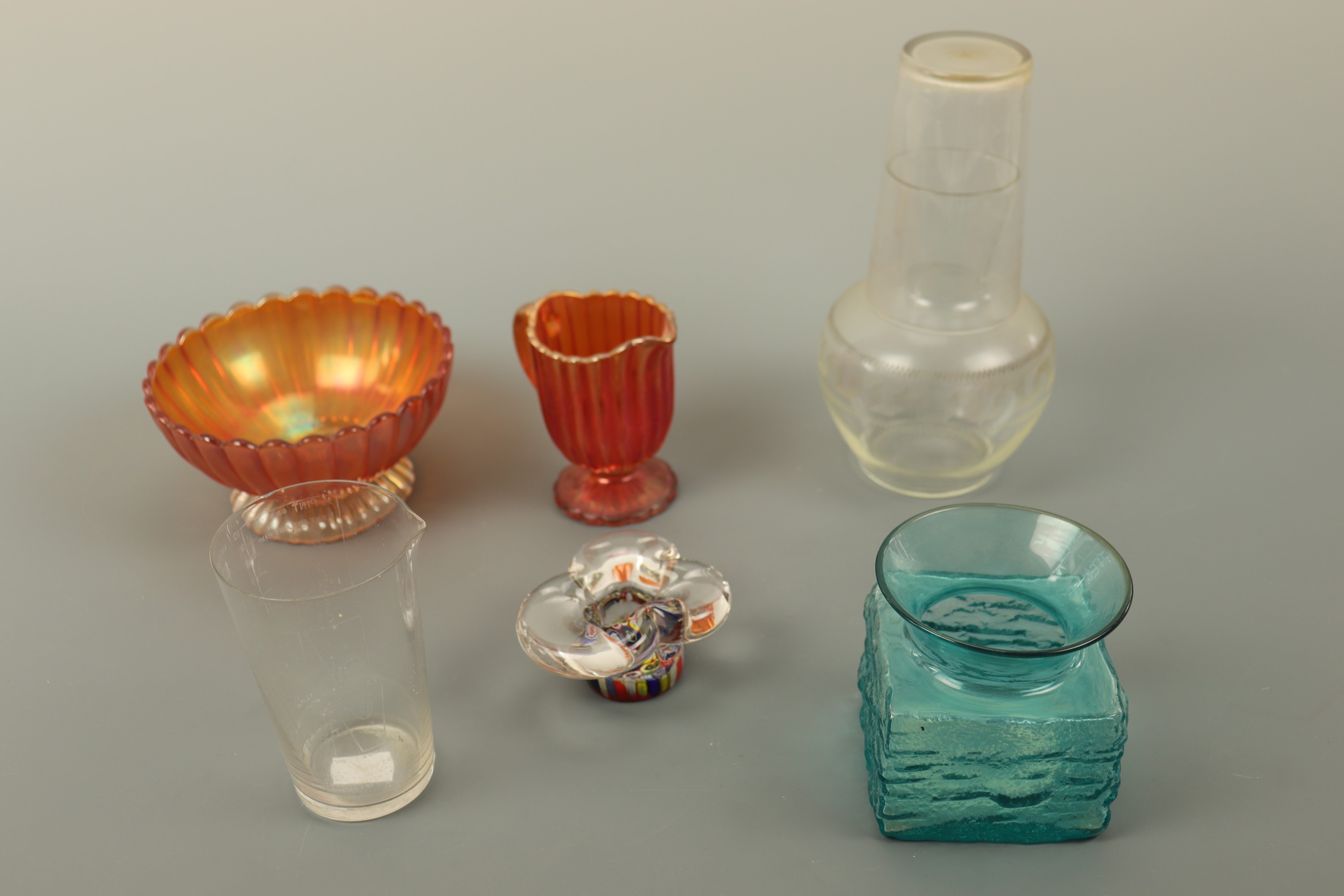 A small Strathearn mille-fiori paperweight together with a carafe, domestic measure etc.
