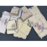 A quantity of vintage matching tea table linens, including three table cloth and napkin sets